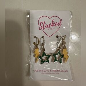 Stacked earrings in gold and green.